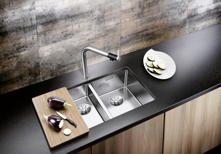 Black kitchen worktop with a satin steel undermount Blanco Andano sink