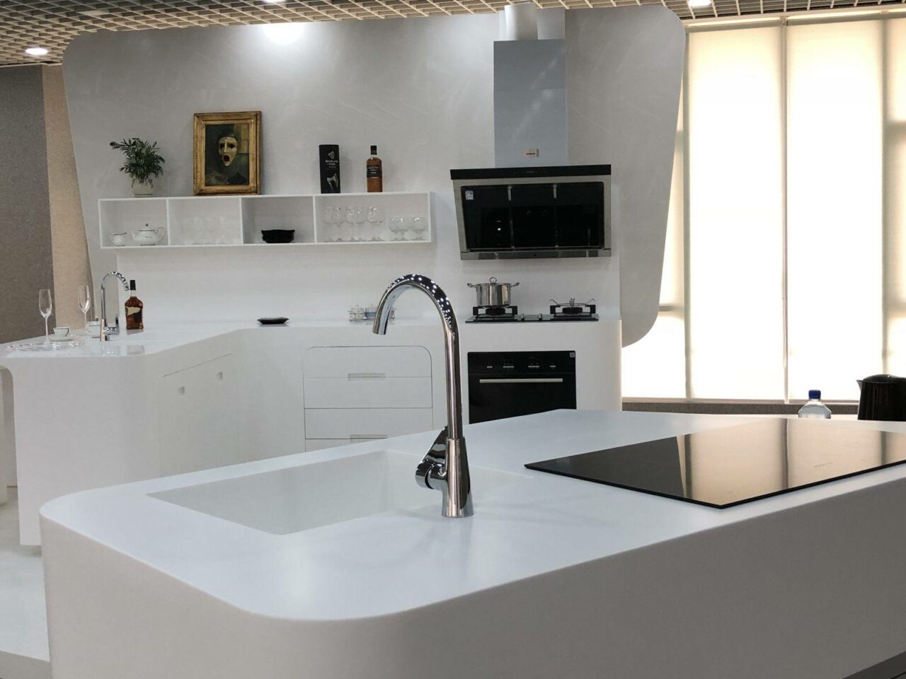 White kitchen with white Durasein® curved worktops