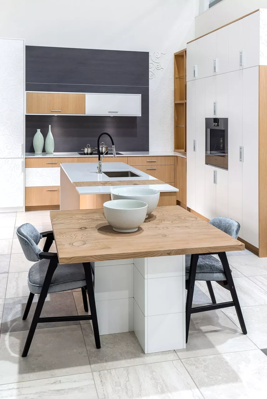White kitchen with wooden effect worktop in Neolith® La Boheme