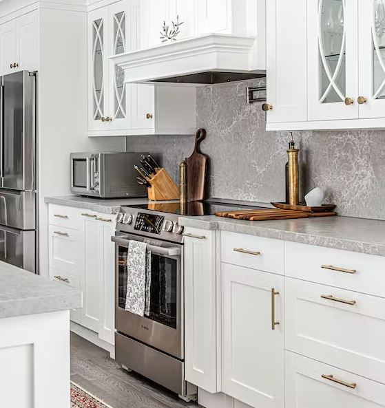 Grey marble effect Silestone® worktop and splashback in a white kitchen