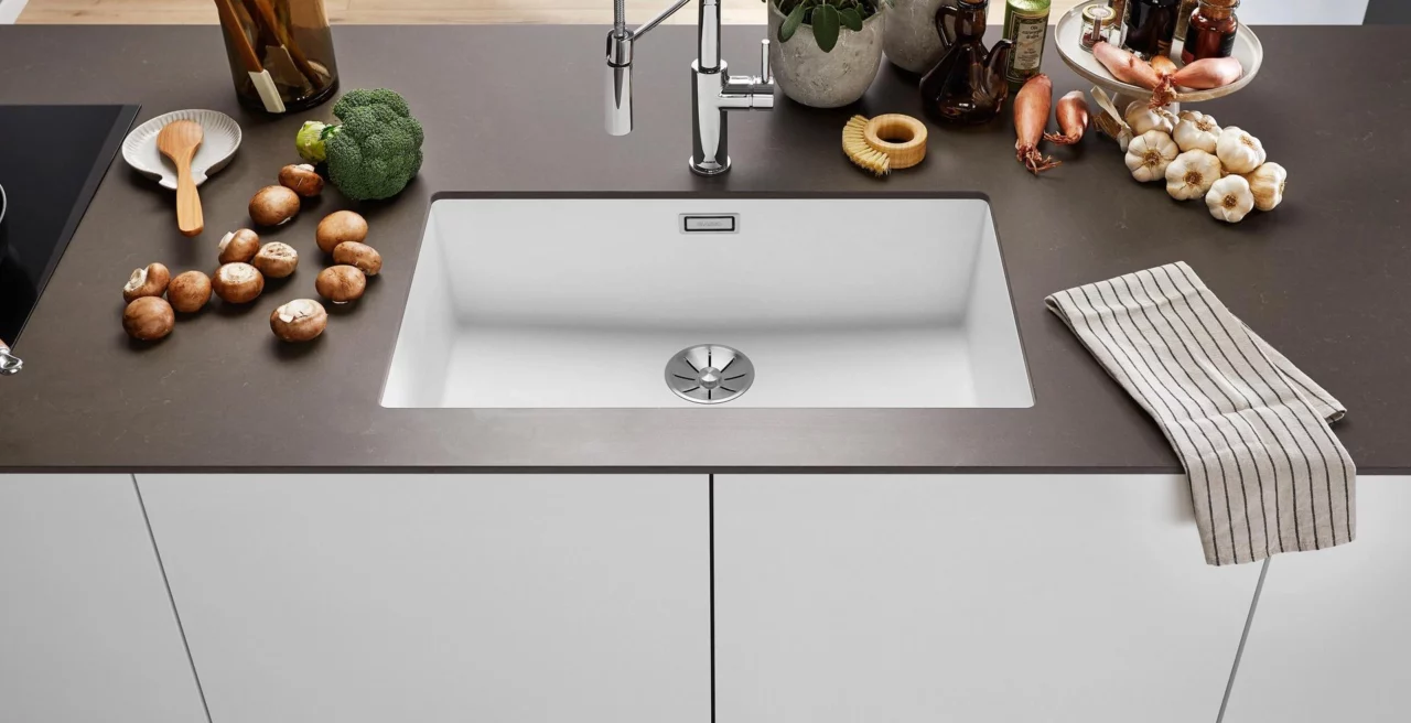Brown kitchen worktop with a white undermount Blanco Subline sink